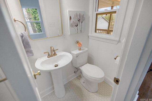 bathroom with toilet and sink