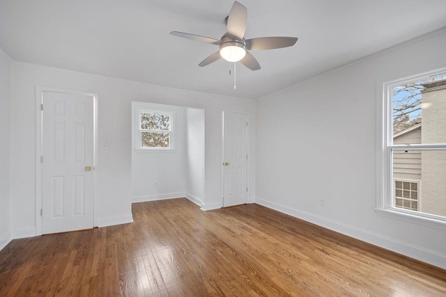 empty room featuring ceiling fan and light hardwood / wood-style flooring