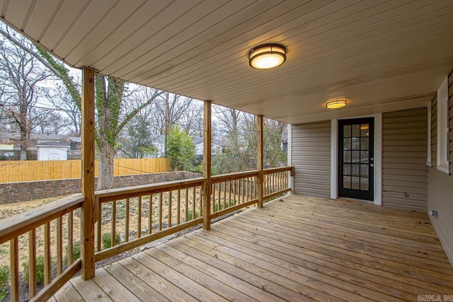 wooden deck featuring a water view