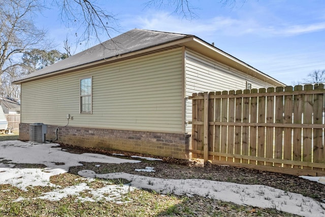 view of side of property with cooling unit