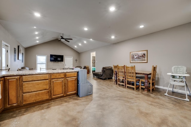 kitchen featuring vaulted ceiling and ceiling fan