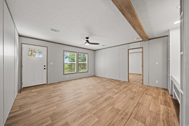 unfurnished living room with a ceiling fan, light wood finished floors, and a textured ceiling