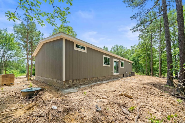 view of side of property featuring cooling unit