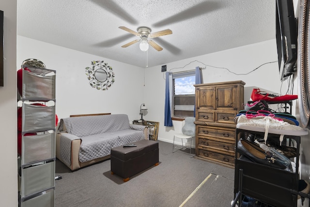 interior space with ceiling fan and a textured ceiling