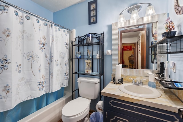 full bathroom with vanity, a textured ceiling, toilet, and shower / bath combo with shower curtain