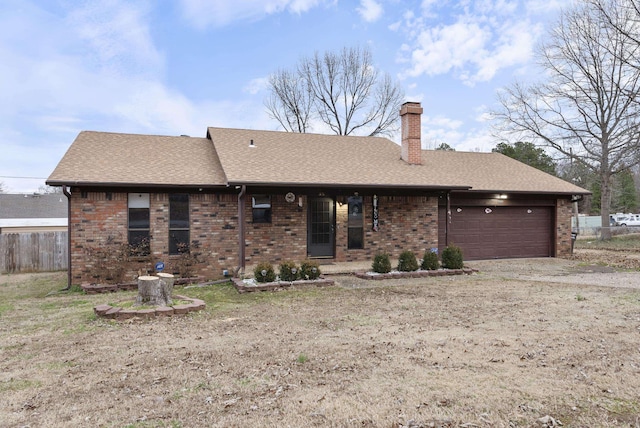 ranch-style home featuring a garage