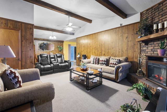 carpeted living room with lofted ceiling with beams, a textured ceiling, wooden walls, and a fireplace