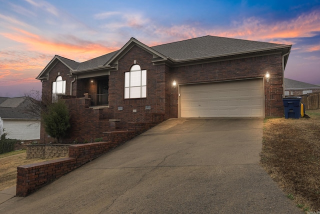 ranch-style home featuring a garage