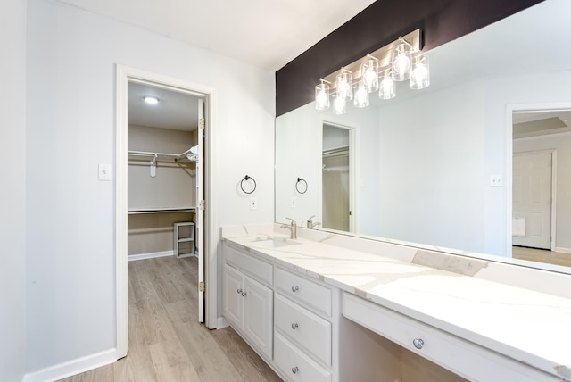 bathroom featuring vanity and hardwood / wood-style floors