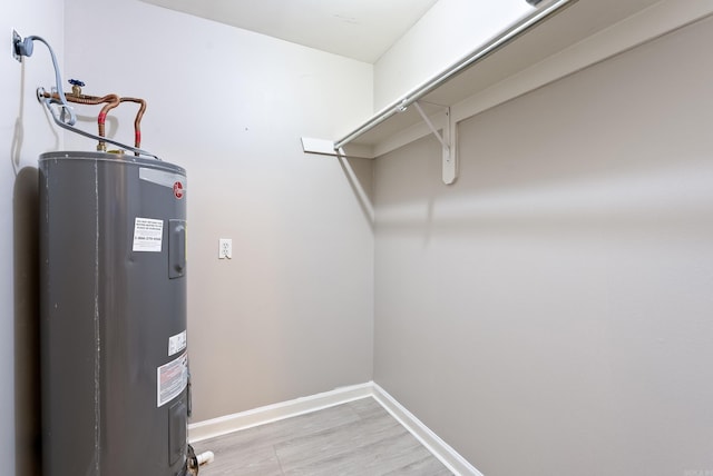 utility room featuring water heater