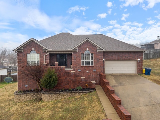 view of front of house with a garage, covered porch, and a front yard