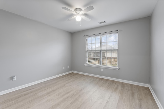 unfurnished room featuring ceiling fan and light wood-type flooring