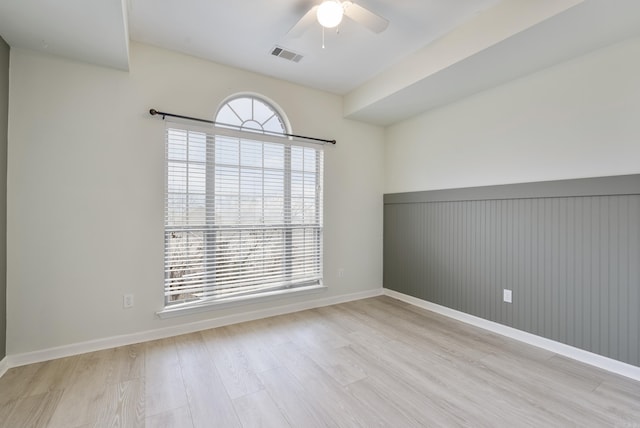 unfurnished room with light hardwood / wood-style flooring and ceiling fan