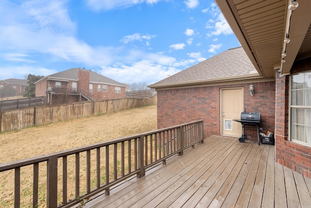 wooden terrace with area for grilling