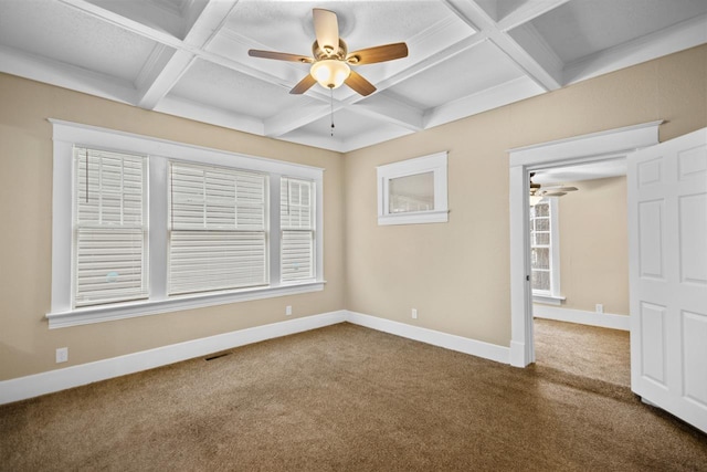 carpeted spare room featuring beamed ceiling, ceiling fan, and coffered ceiling