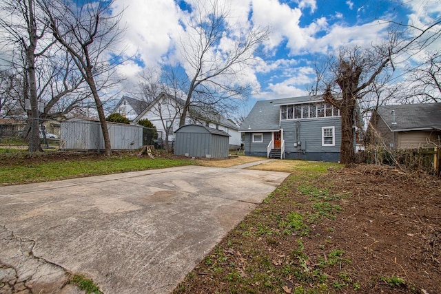 view of front of property with a shed