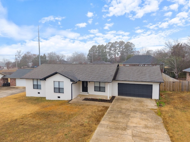 single story home with a garage and a front yard