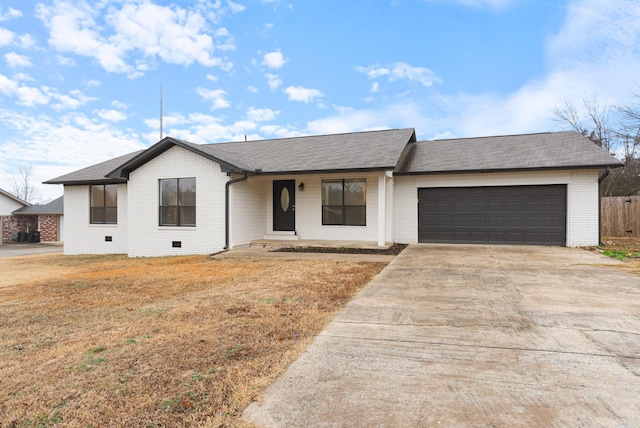 ranch-style home featuring a garage and a front yard