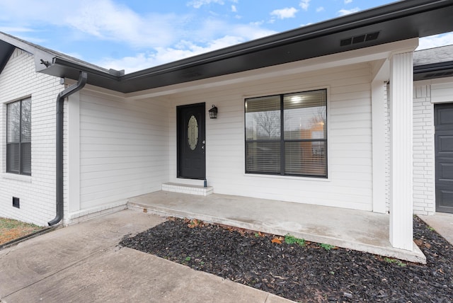 property entrance featuring covered porch