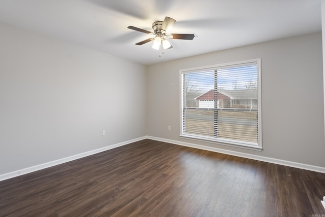 unfurnished room featuring dark hardwood / wood-style floors and ceiling fan