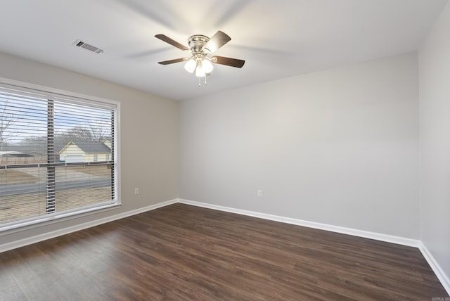 unfurnished room with dark hardwood / wood-style floors and ceiling fan