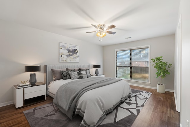 bedroom featuring dark wood-type flooring and ceiling fan