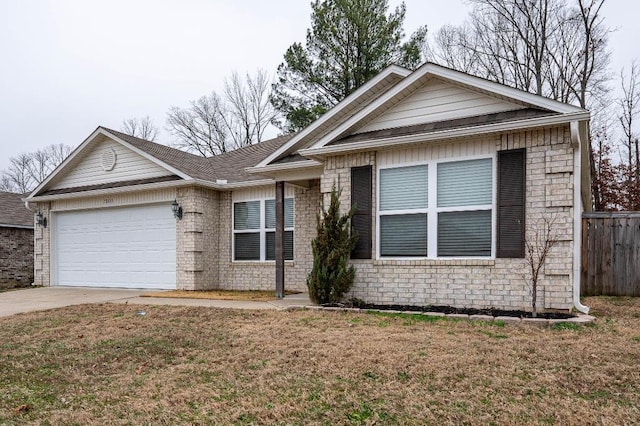 view of front facade with a garage and a front yard