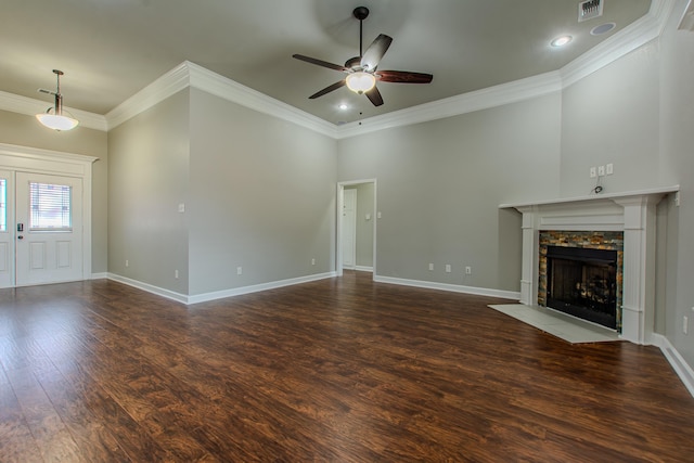 unfurnished living room featuring crown molding, ceiling fan, and dark hardwood / wood-style floors