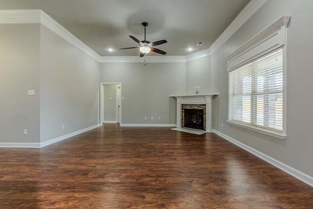 unfurnished living room featuring ceiling fan, ornamental molding, and dark hardwood / wood-style floors