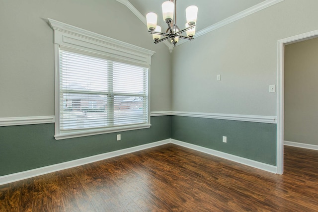 spare room with dark hardwood / wood-style flooring, ornamental molding, and an inviting chandelier