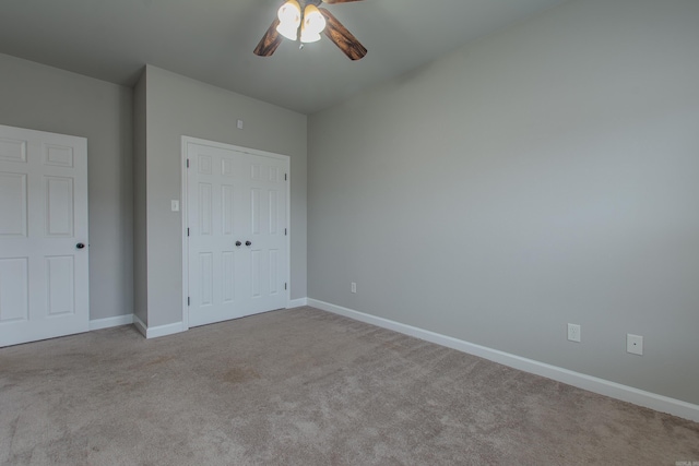 unfurnished bedroom with light carpet, a closet, and ceiling fan