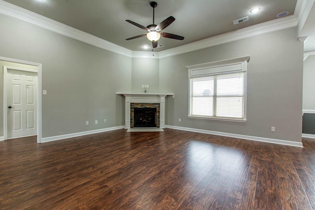 unfurnished living room with ceiling fan, dark hardwood / wood-style floors, crown molding, and a fireplace