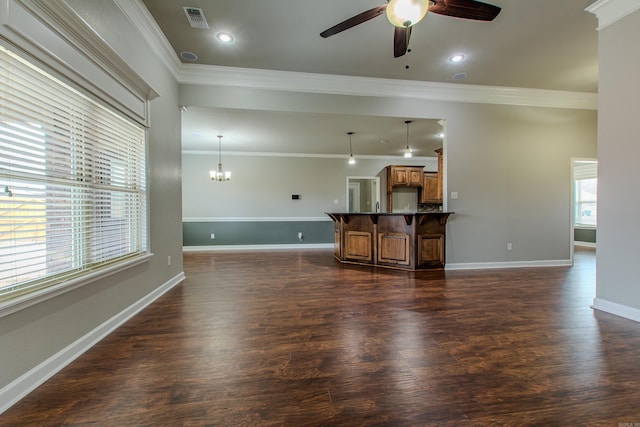 living room featuring ornamental molding, dark hardwood / wood-style floors, and ceiling fan with notable chandelier