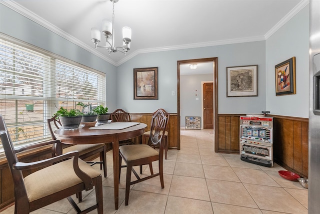 tiled dining room featuring crown molding, vaulted ceiling, an inviting chandelier, and wood walls