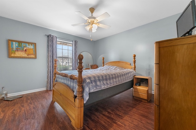 bedroom featuring dark hardwood / wood-style flooring and ceiling fan