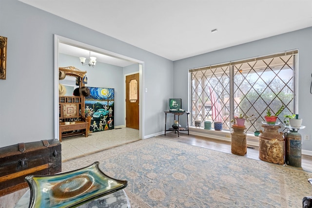 living area featuring a notable chandelier