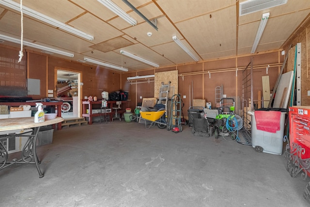 garage with a workshop area