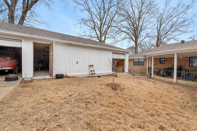 view of side of property featuring a garage and an outdoor structure