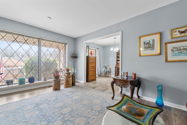 entryway with a notable chandelier and light wood-type flooring