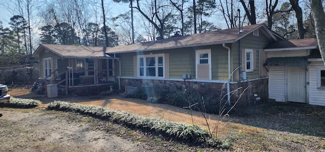 rear view of house with a sunroom