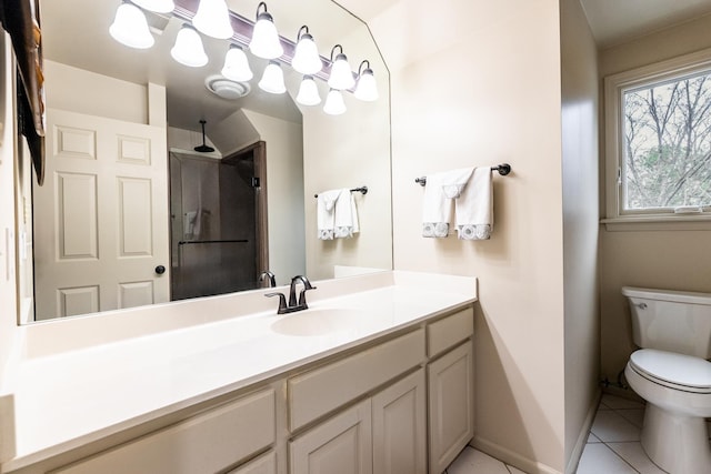 bathroom with vanity, tile patterned floors, and toilet