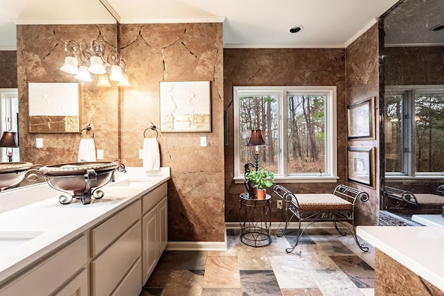 bathroom with crown molding and vanity