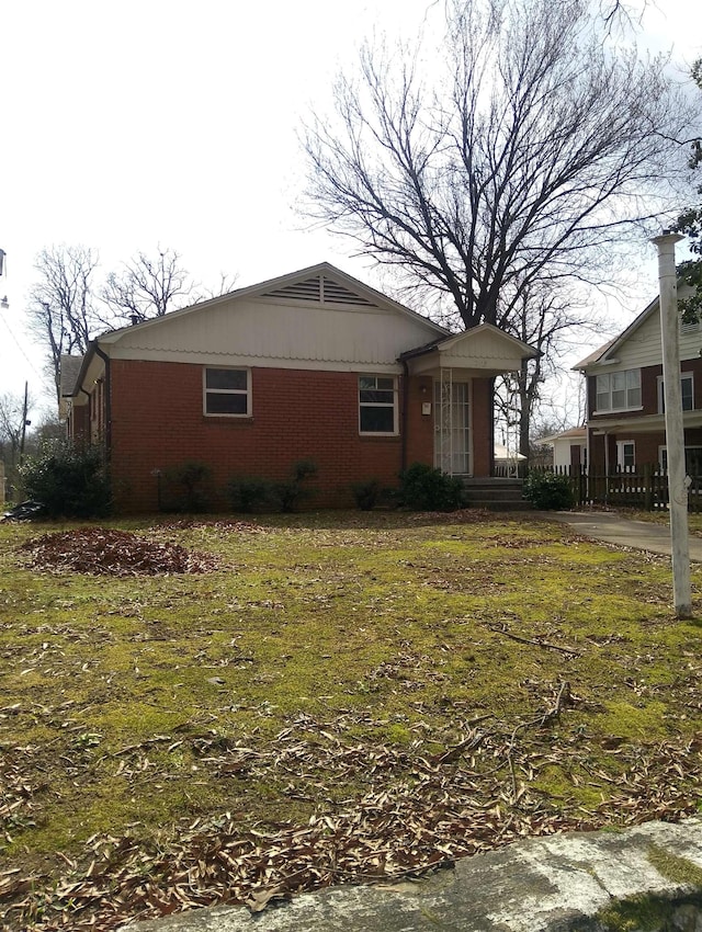 view of property exterior featuring a lawn