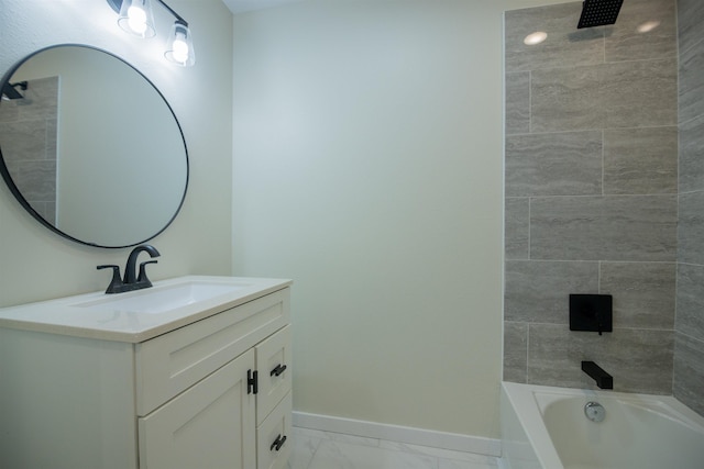 bathroom with vanity and tiled shower / bath combo