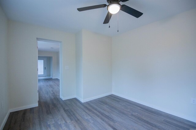 empty room featuring dark wood-type flooring