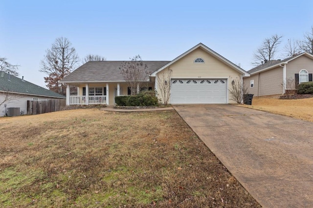 ranch-style house featuring a garage, central AC, covered porch, and a front lawn