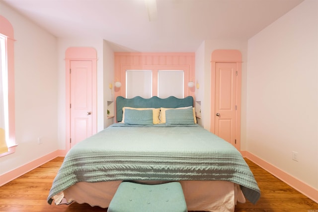 bedroom with hardwood / wood-style flooring