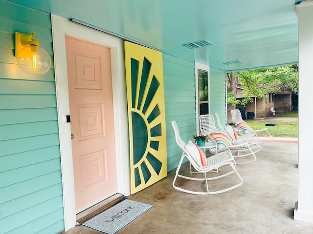 property entrance featuring covered porch