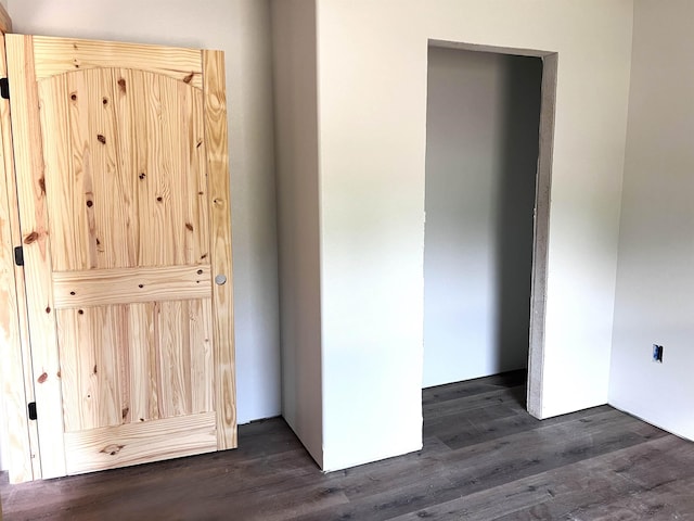 605 Frances Cv, Mountain View, AR 72560 - unfurnished bedroom with dark wood-style floors