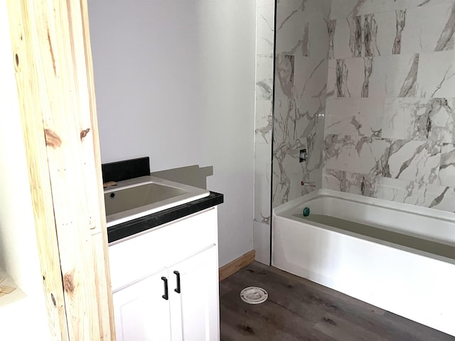 605 Frances Cv, Mountain View, AR 72560 - bathroom with wood finished floors, vanity, and shower / tub combination